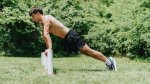 Fit man performing a plyo incline pushup exercise