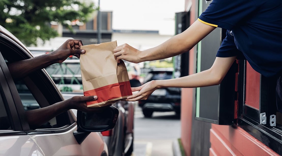 Person ordering from a one of the healthiest fast-food orders from the drive thru